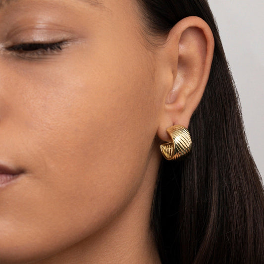 Close detail of the Chunky Textured Hoop Earrings in Gold-Plated Steel. Tarnish-resistant, premium handmade jewelry.