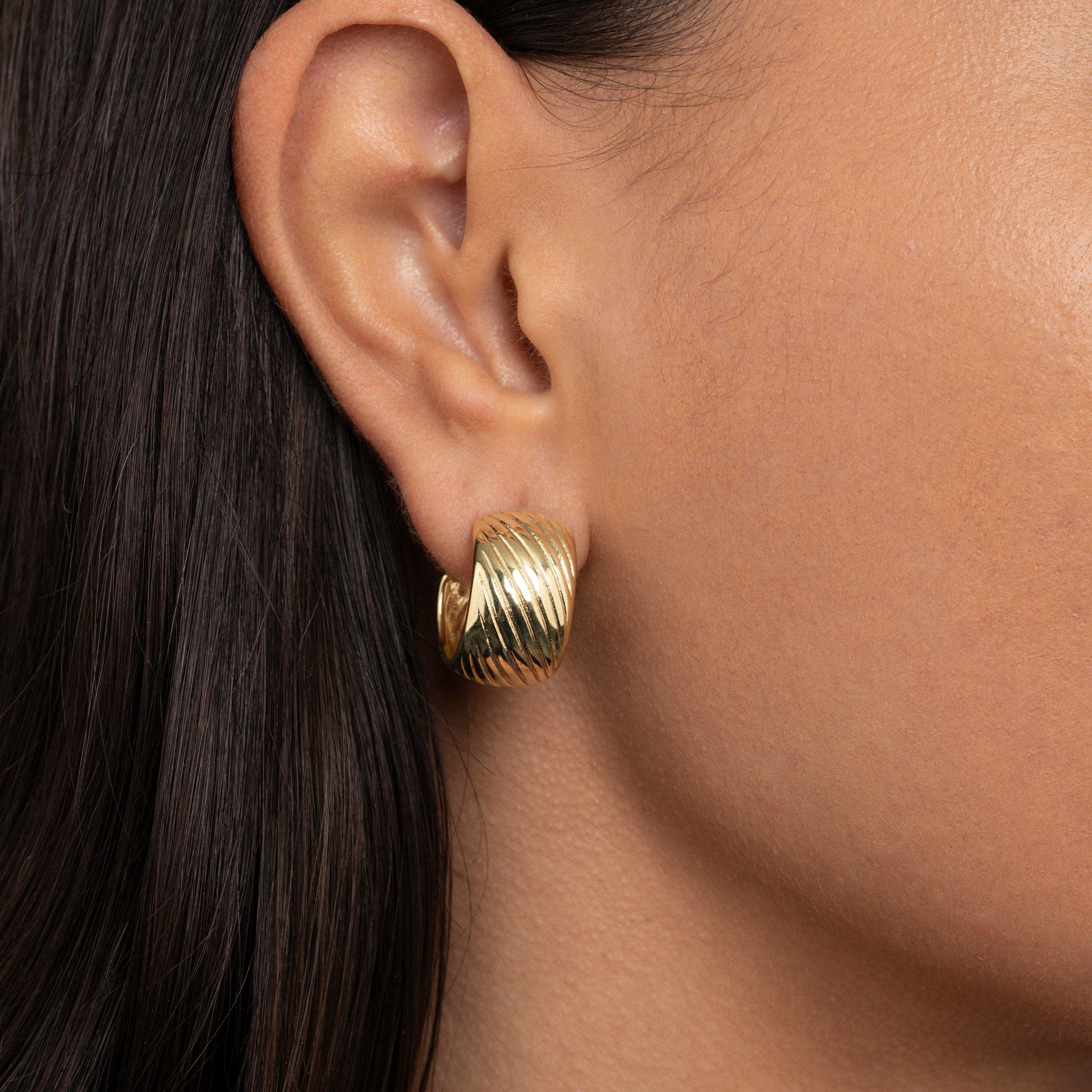 The Chunky Textured Hoop Earrings as an anniversary gift in Gold-Plated Steel. Tarnish-resistant, made for keeping.