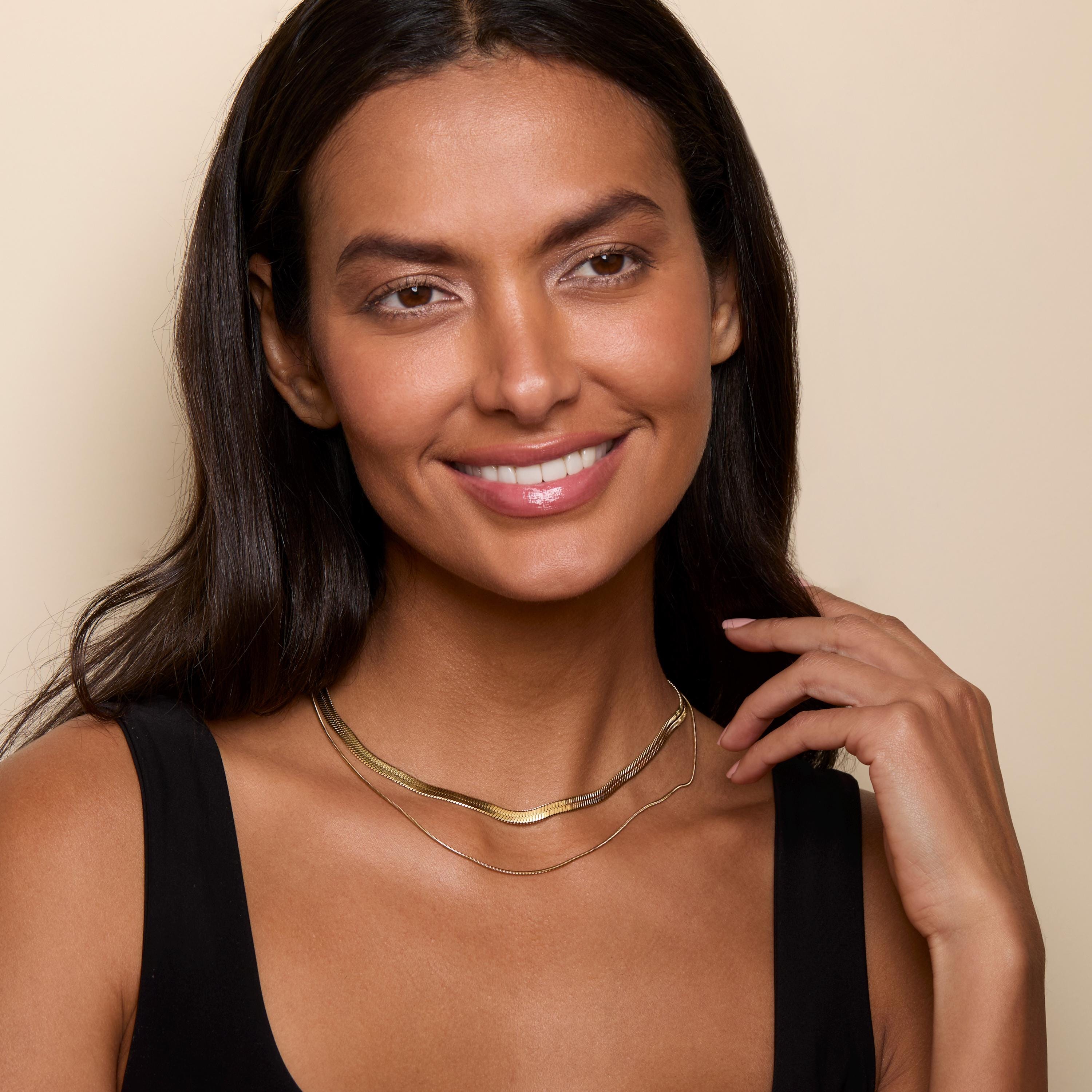 Layered Herringbone and Snake Necklace as a thoughtful birthday gift in Gold-Plated Steel. Hypoallergenic, no green marks.