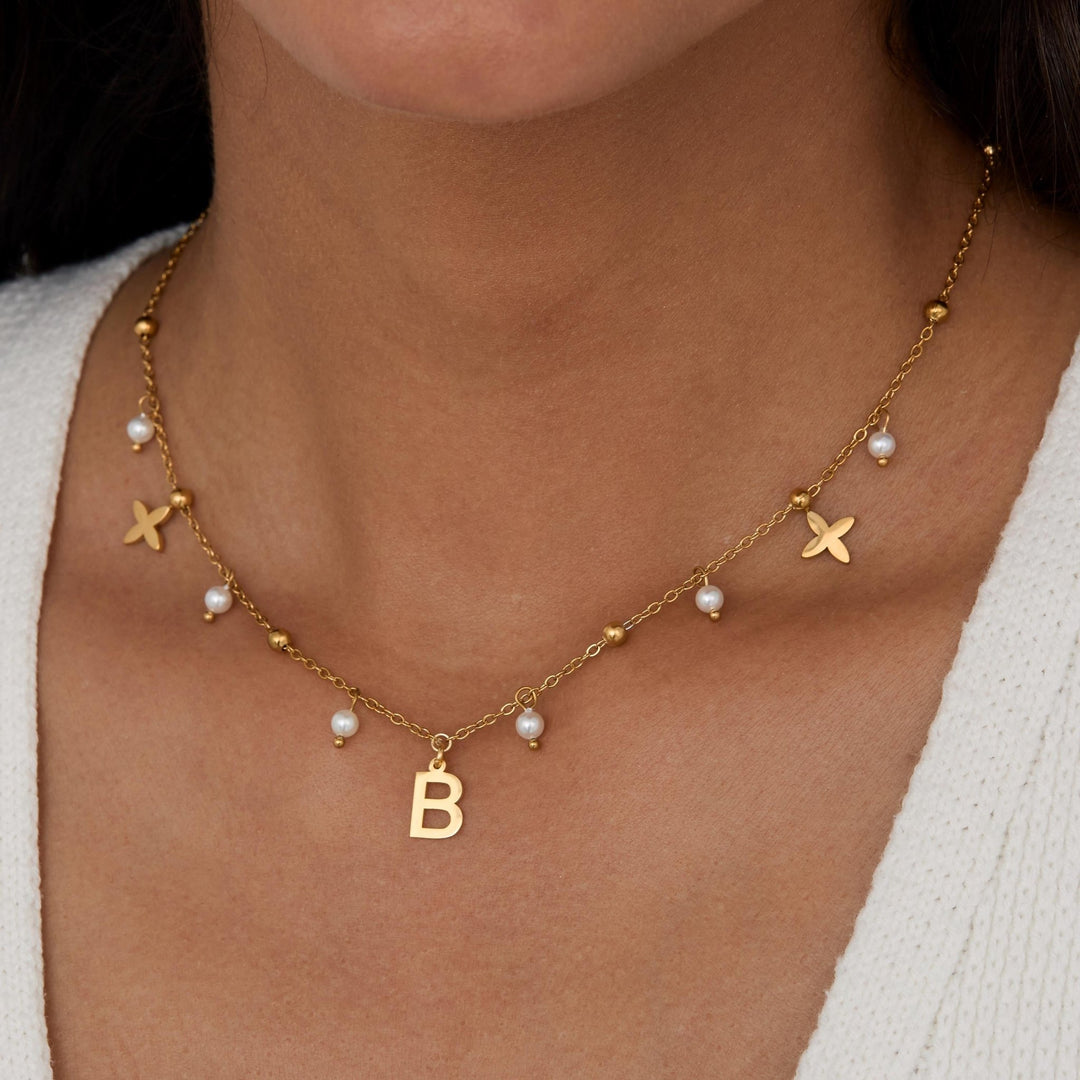 Initial Necklace with Pearls as a thoughtful birthday gift in Gold-Plated Steel with Freshwater Pearl. Hypoallergenic, no.