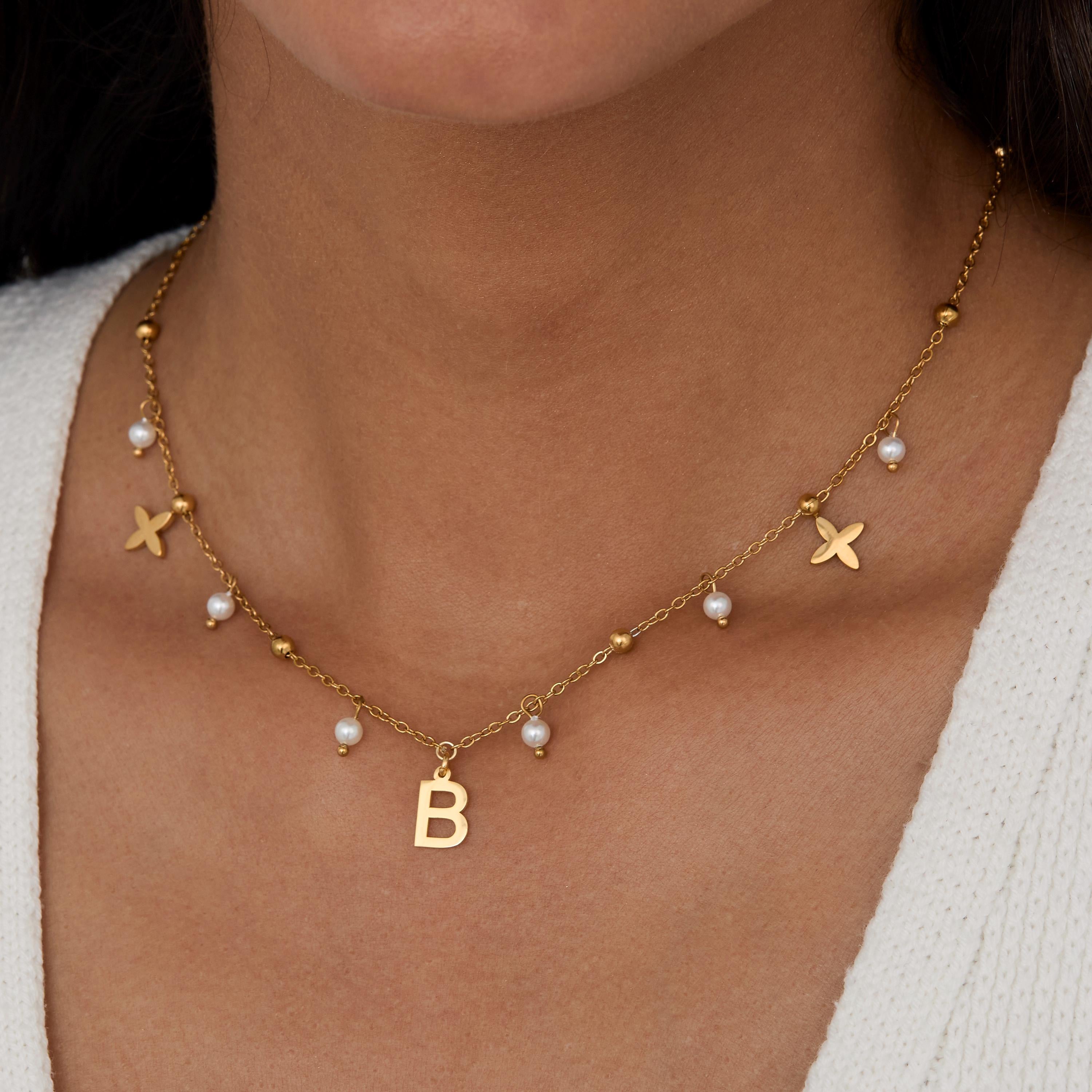 Initial Necklace with Pearls as a thoughtful birthday gift in Gold-Plated Steel with Freshwater Pearl. Hypoallergenic, no.