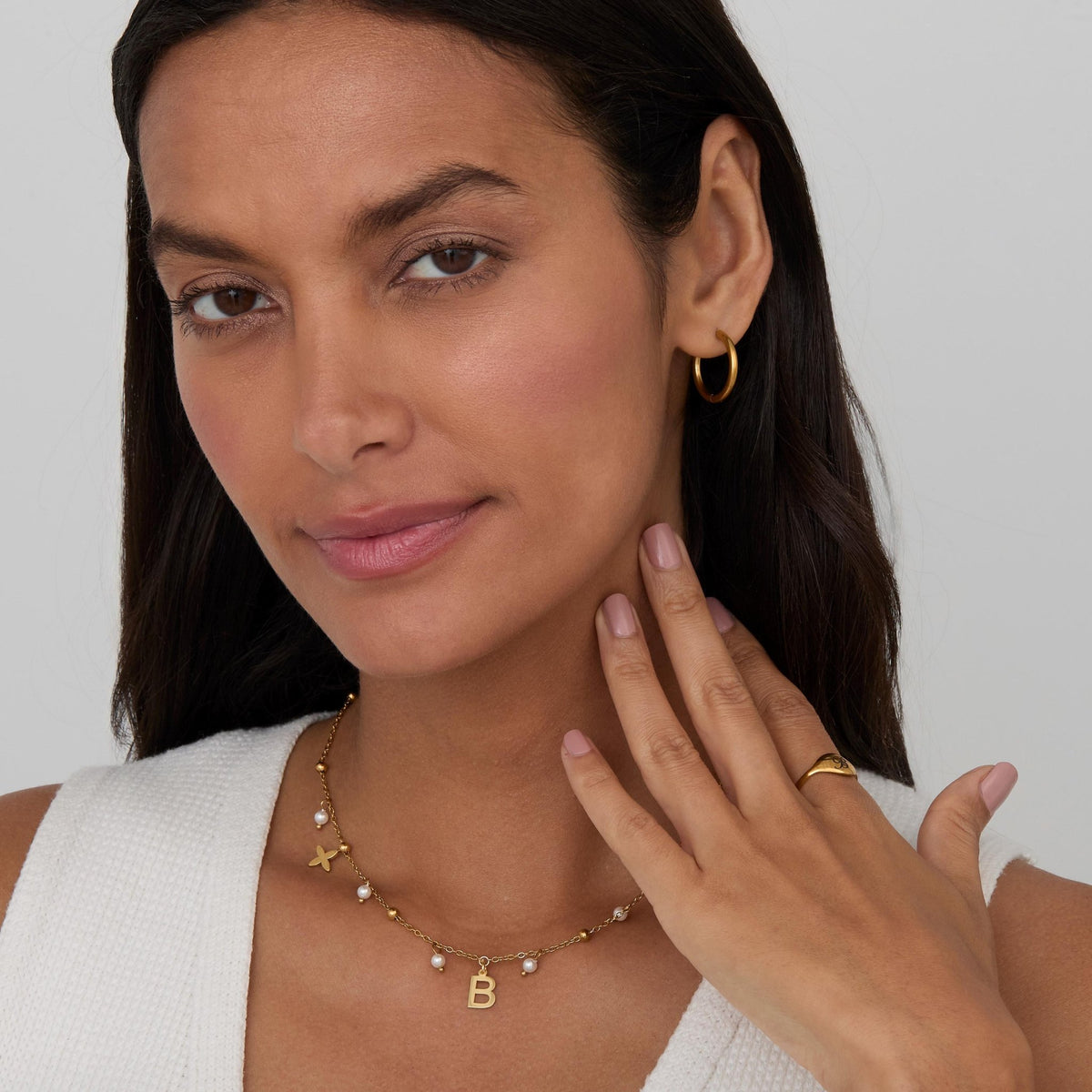 The Initial Necklace with Pearls styled in Gold-Plated Steel — elegant everyday jewelry. Hypoallergenic, no green marks.