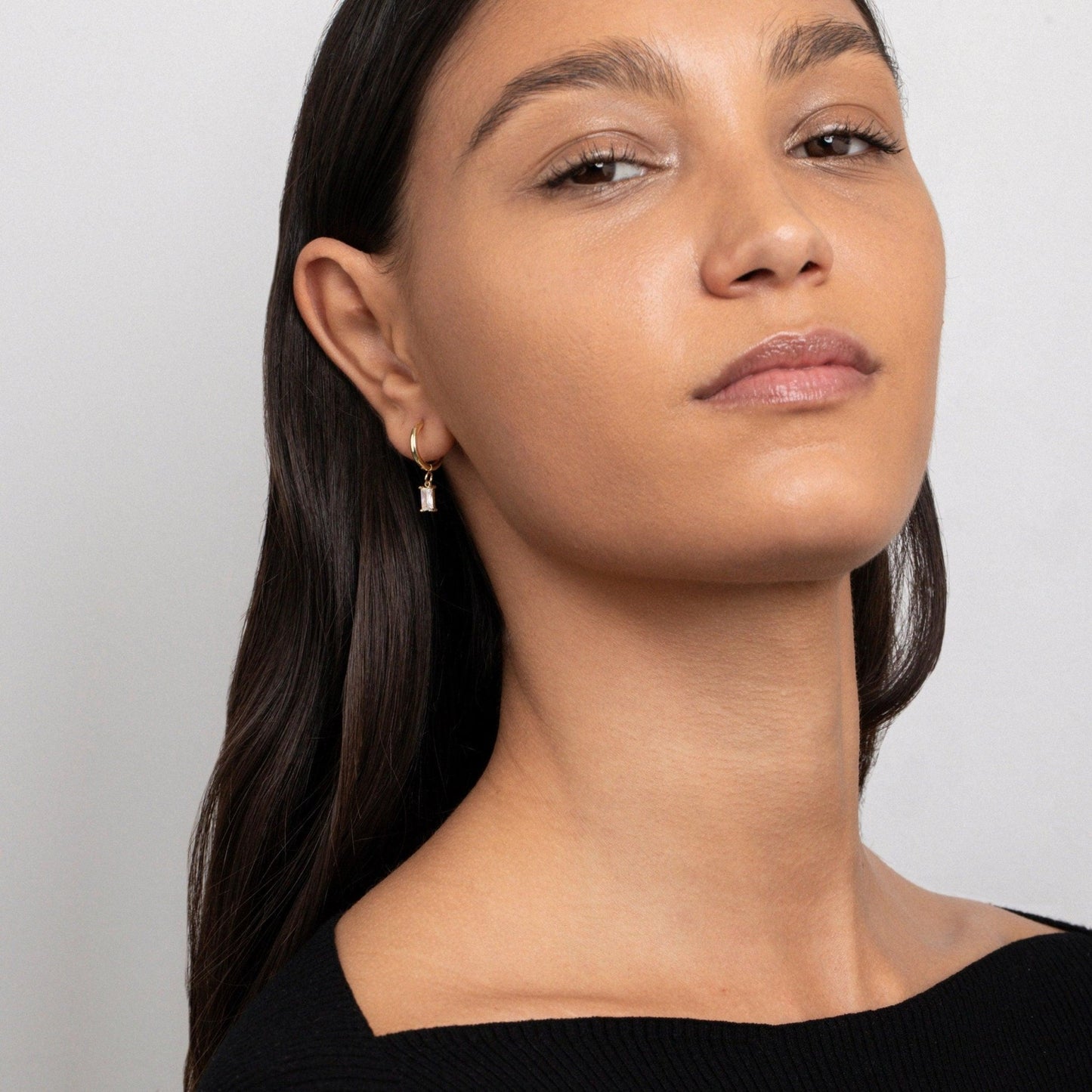 The Dangling Baguette CZ Diamond Hoop Earrings as a wedding gift in Gold-Plated Steel. Tarnish-resistant, made for keeping.