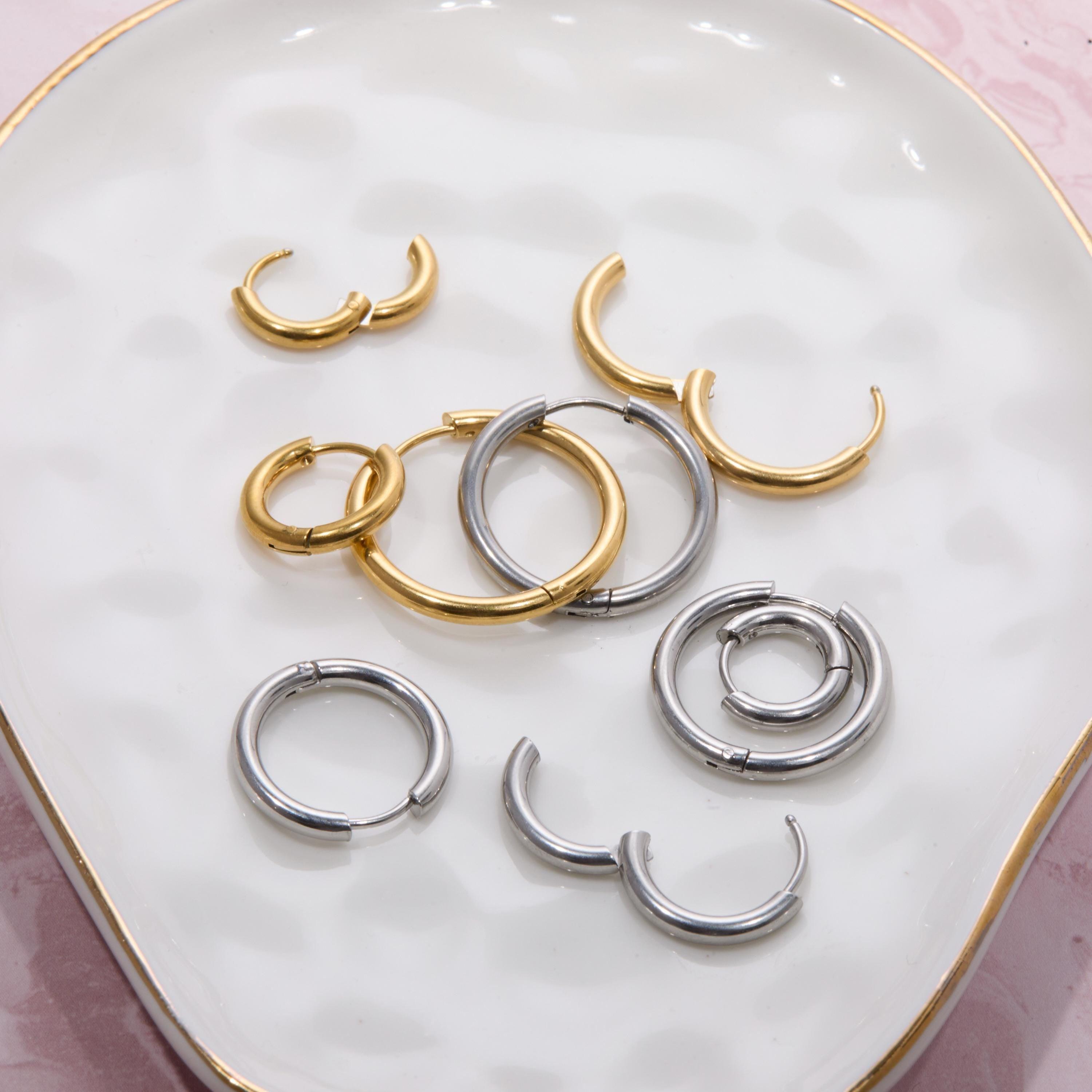 Macro detail of the 18K Plated Gold Hoop Earrings Multi Size showcasing craftsmanship in Gold-Plated Steel. No green marks.