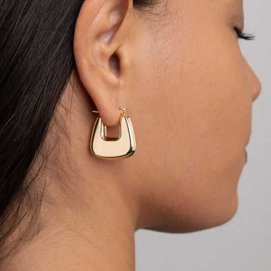 Close detail of the Geometric Hexagon Hoop Earrings in Gold-Plated Steel. Tarnish-resistant, premium handmade jewelry.