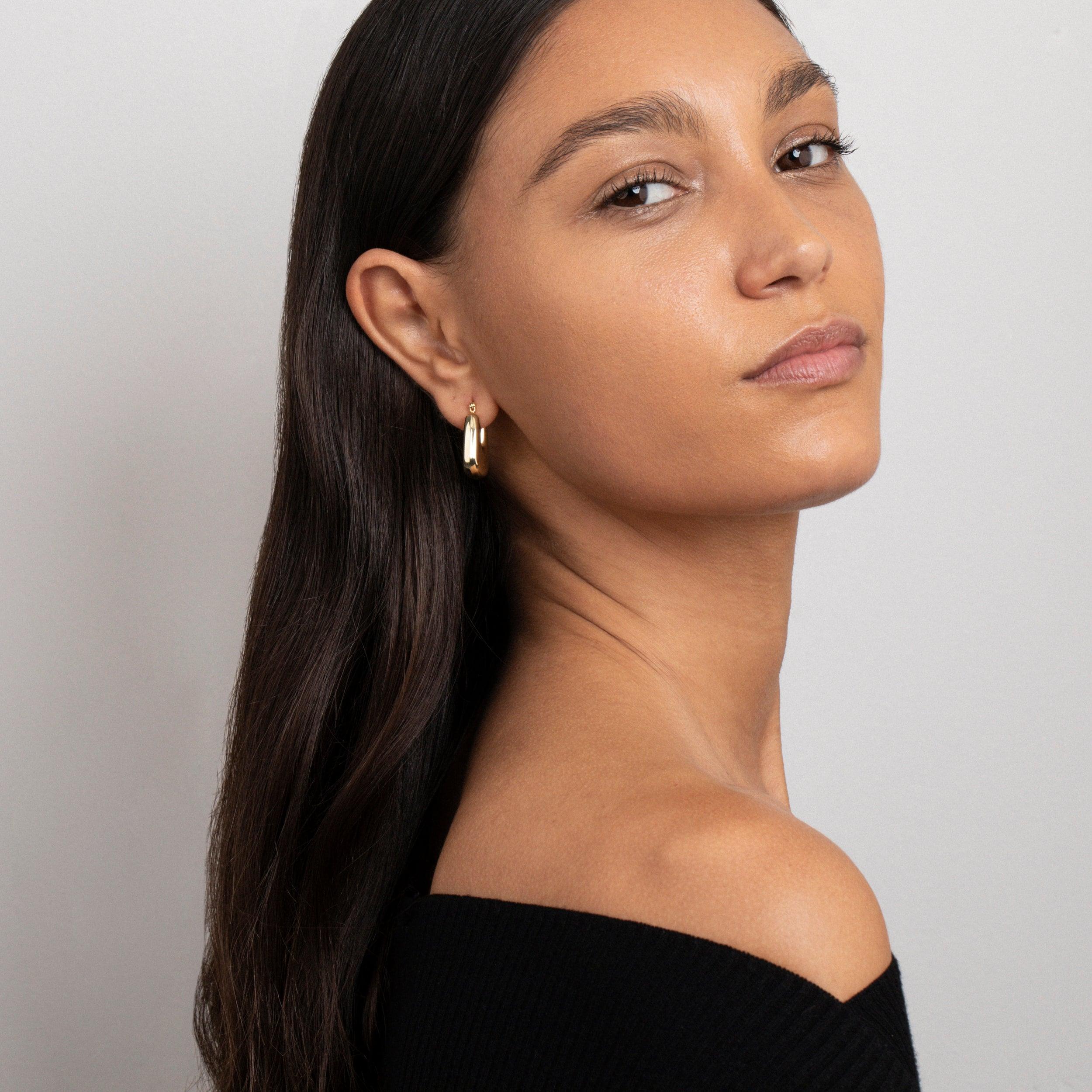 The Geometric Hexagon Hoop Earrings styled in Gold-Plated Steel — elegant everyday jewelry. Hypoallergenic for sensitive.