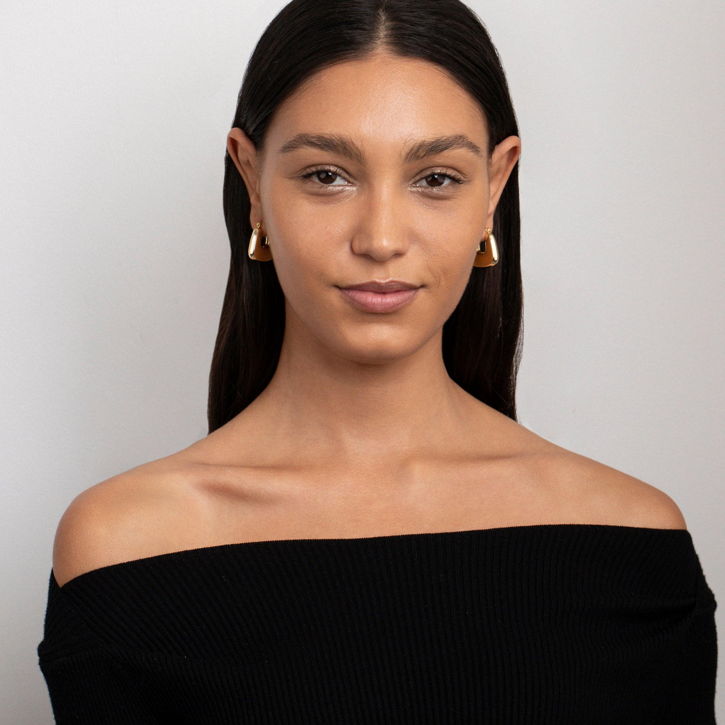 The Geometric Hexagon Hoop Earrings as an anniversary gift in Gold-Plated Steel. Tarnish-resistant, made for keeping.