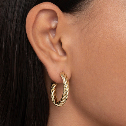 Close detail of the Twisted Hoop Earrings in Gold-Plated Steel. Tarnish-resistant, premium handmade jewelry.