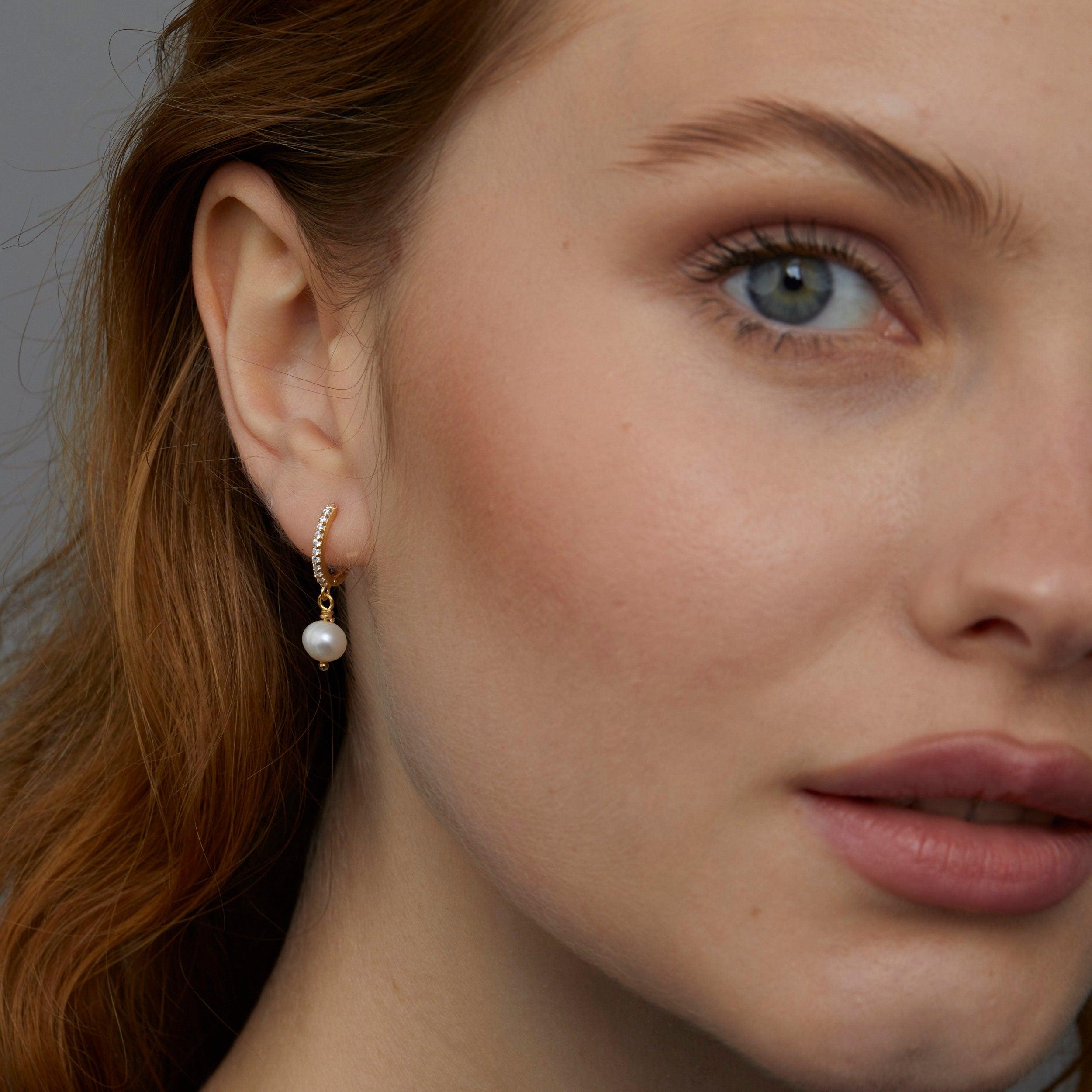 Macro detail of the Pavé Pearl Hoop Earrings: Freshwater Pearl set in 18K Gold Vermeil. No green marks, handmade jewelry.