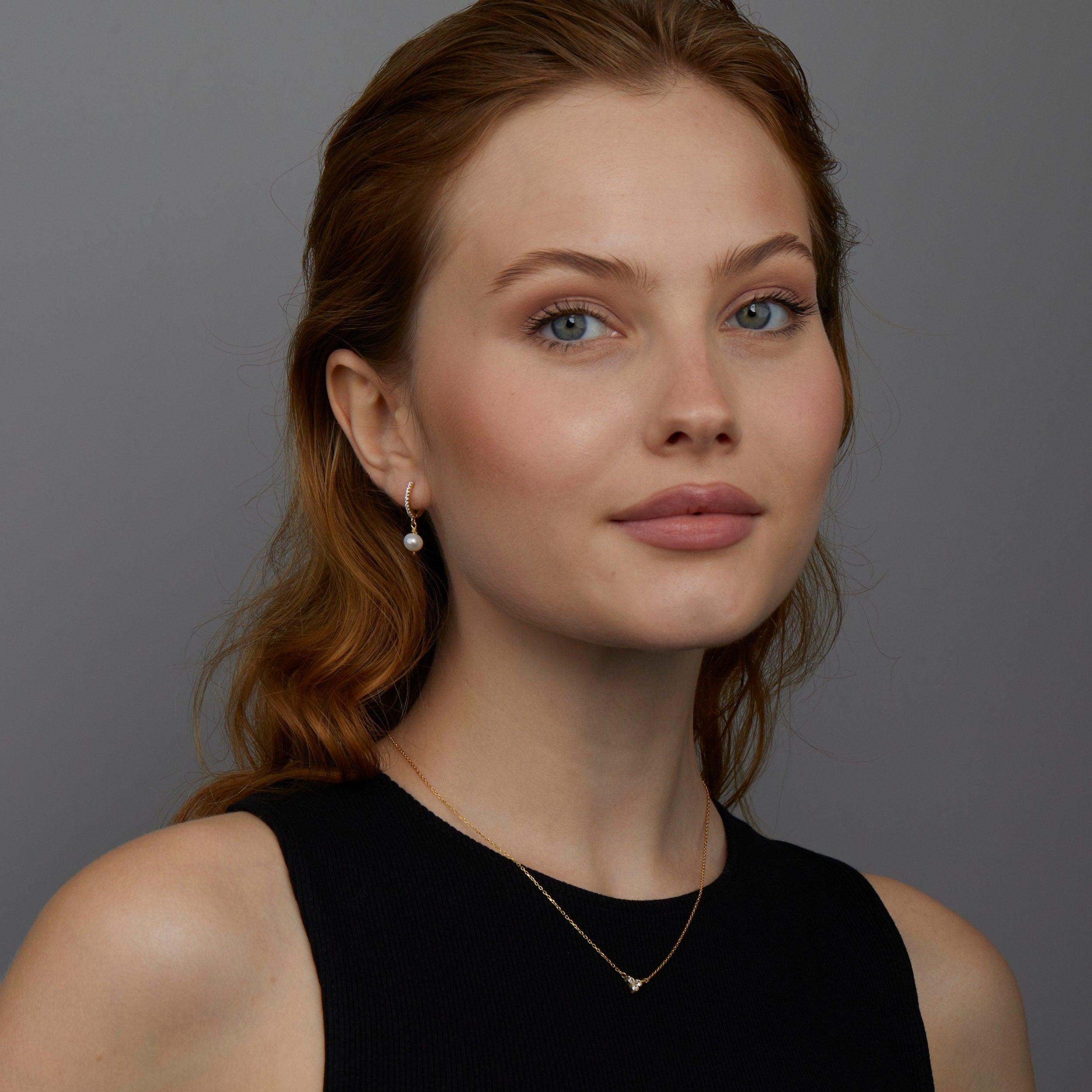 The Pavé Pearl Hoop Earrings styled in 18K Gold Vermeil — elegant everyday jewelry. Hypoallergenic for sensitive ears.