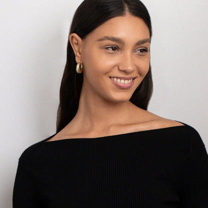The Shrimp Shell Hoop Earrings as an anniversary gift in Gold-Plated Steel. Tarnish-resistant, made for keeping.