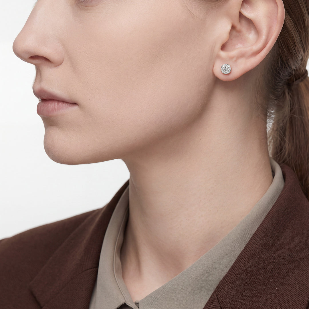 Profile view of 0.27 ct natural diamond cluster stud earrings in 14K white gold worn on the ear