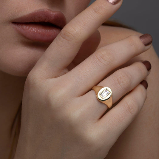 Close detail of the Baguette Diamond Signet Ring in 18K Gold Vermeil with CZ Diamond. Hypoallergenic, no green marks.