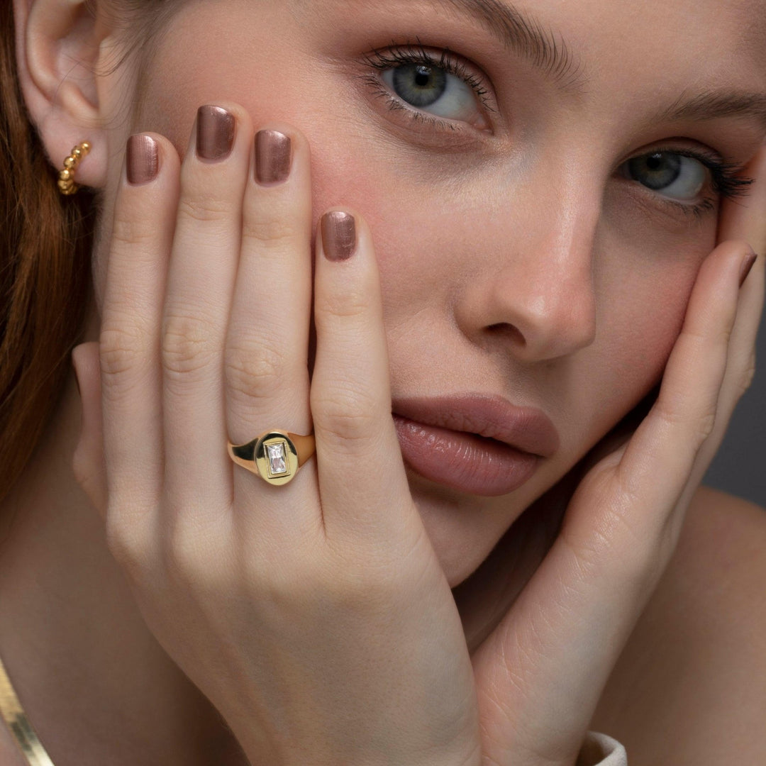 The Baguette Diamond Signet Ring styled in 18K Gold Vermeil — elegant everyday jewelry. Tarnish-resistant.