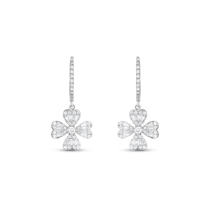 Pair of baguette and round natural diamond clover drop huggie earrings in 18K solid white gold, front view on white