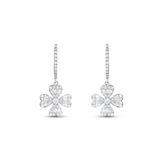 Pair of baguette and round natural diamond clover drop huggie earrings in 18K solid white gold, front view on white