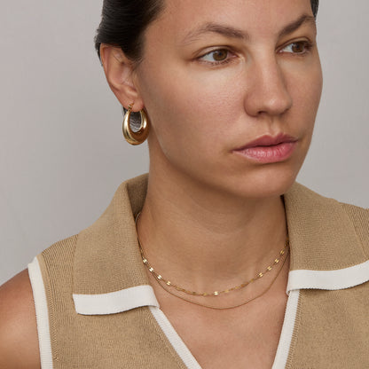 Ball Chain Necklace layered with a second gold chain — layering necklace look.