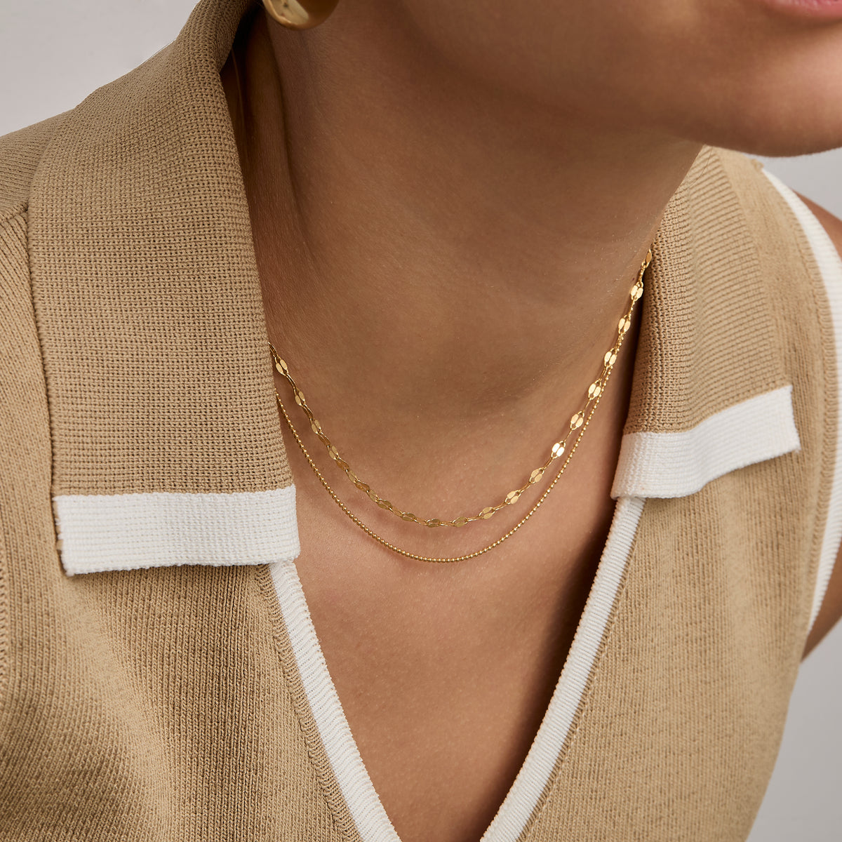 Ball Chain Necklace stacked with a wider gold chain — gold layering stack.