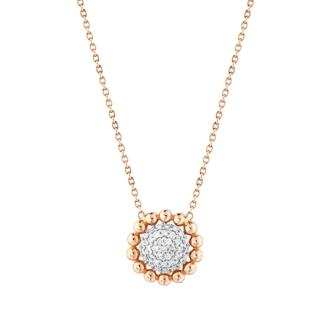 Close-up of the natural diamond pavé disc framed by fourteen rose-gold beads in 14K gold