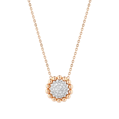 Close-up of the natural diamond pavé disc framed by fourteen rose-gold beads in 14K gold