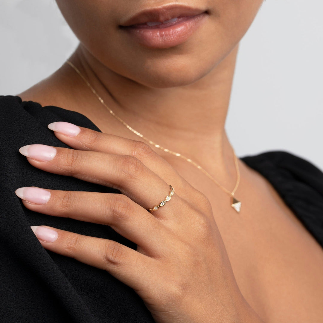 The Bezel Tear Drop Band Ring styled in 18K Gold Vermeil — elegant everyday jewelry. Tarnish-resistant.