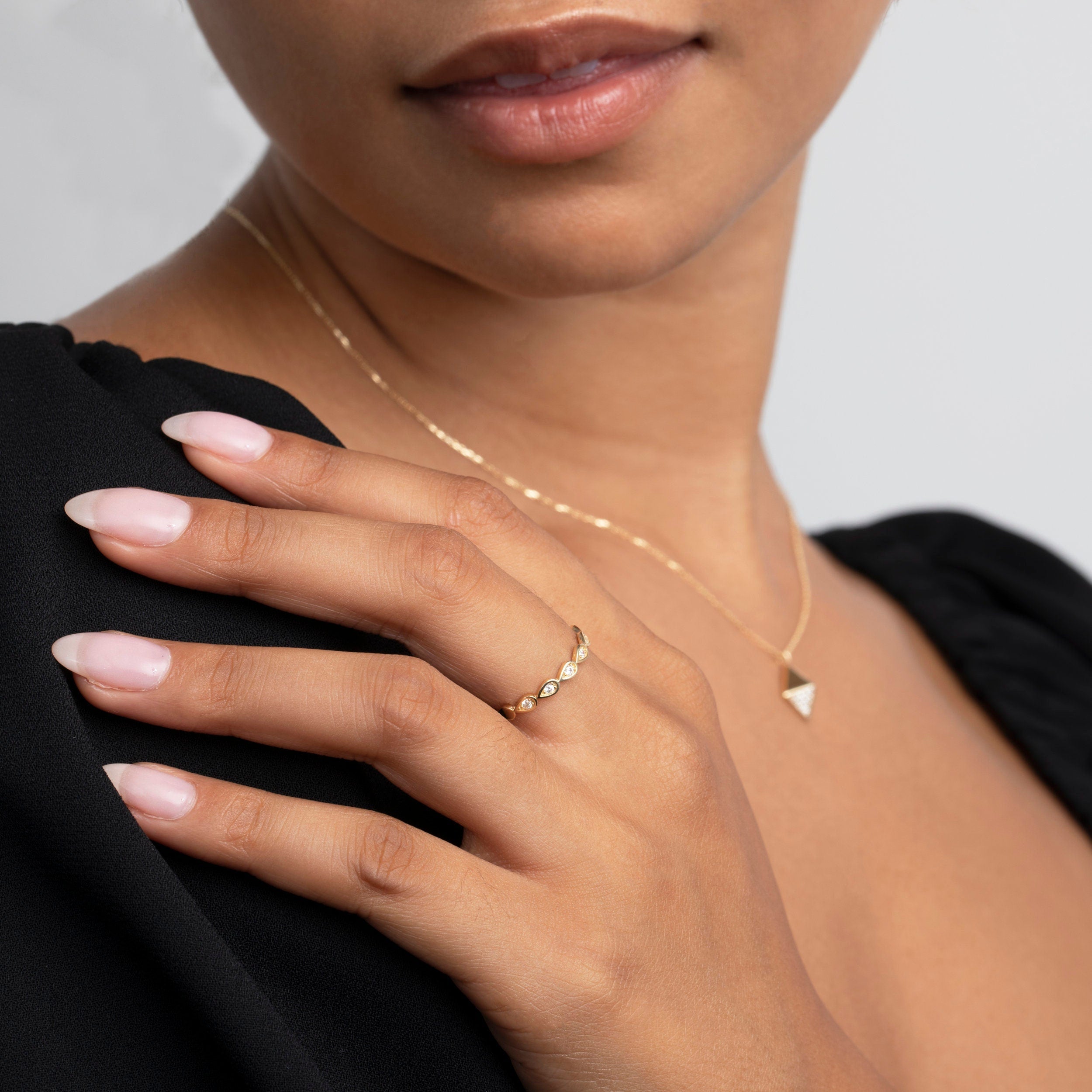 The Bezel Tear Drop Band Ring styled in 18K Gold Vermeil — elegant everyday jewelry. Tarnish-resistant.