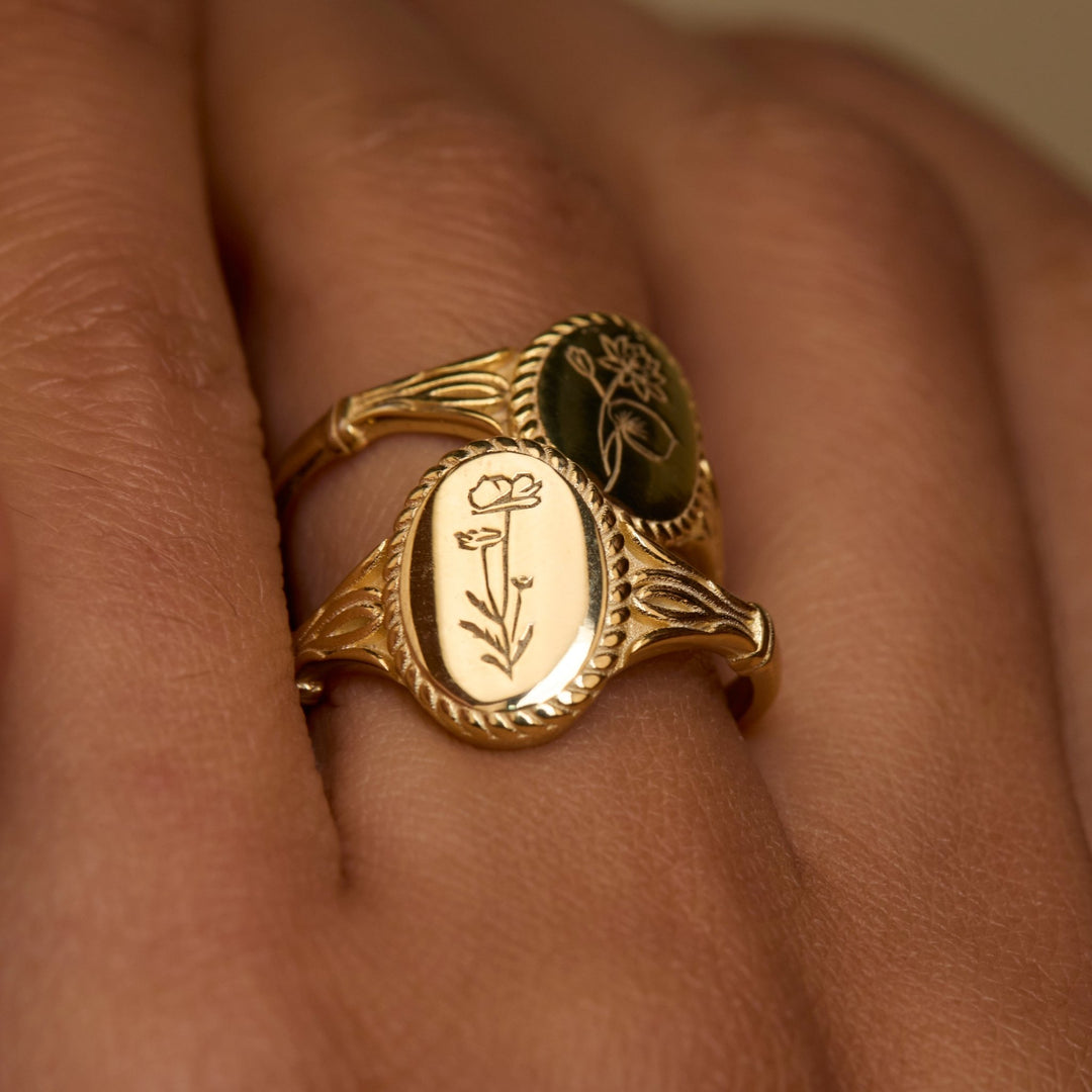 The Birth Flower Signet Ring worn in 18K Gold Vermeil — refined accessory for women. Hypoallergenic, no green marks.