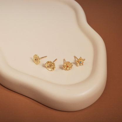 Birth Flower Stud Earrings styled with complementary pieces in 18K Gold Vermeil. Hypoallergenic for sensitive ears, layered.