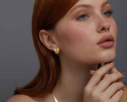 Close detail of the Bold Huggie Hoop Earring in 18K Gold Vermeil. Tarnish-resistant, premium handmade jewelry.