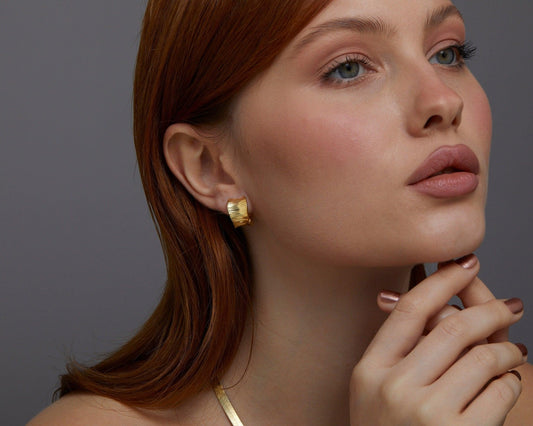 Close detail of the Bold Huggie Hoop Earring in 18K Gold Vermeil. Tarnish-resistant, premium handmade jewelry.