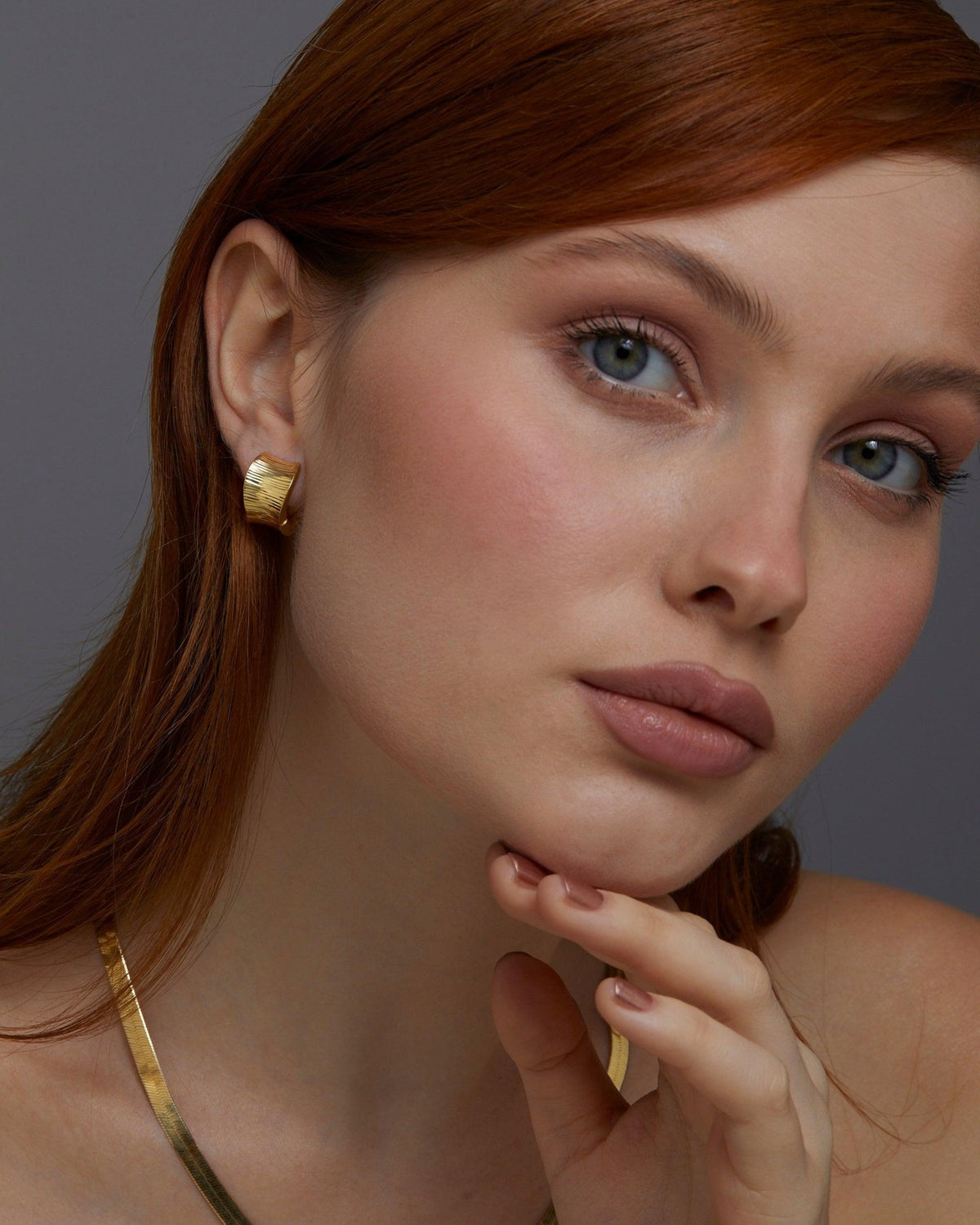 Bold Huggie Hoop Earring as a thoughtful birthday gift in 18K Gold Vermeil. Hypoallergenic for sensitive ears.