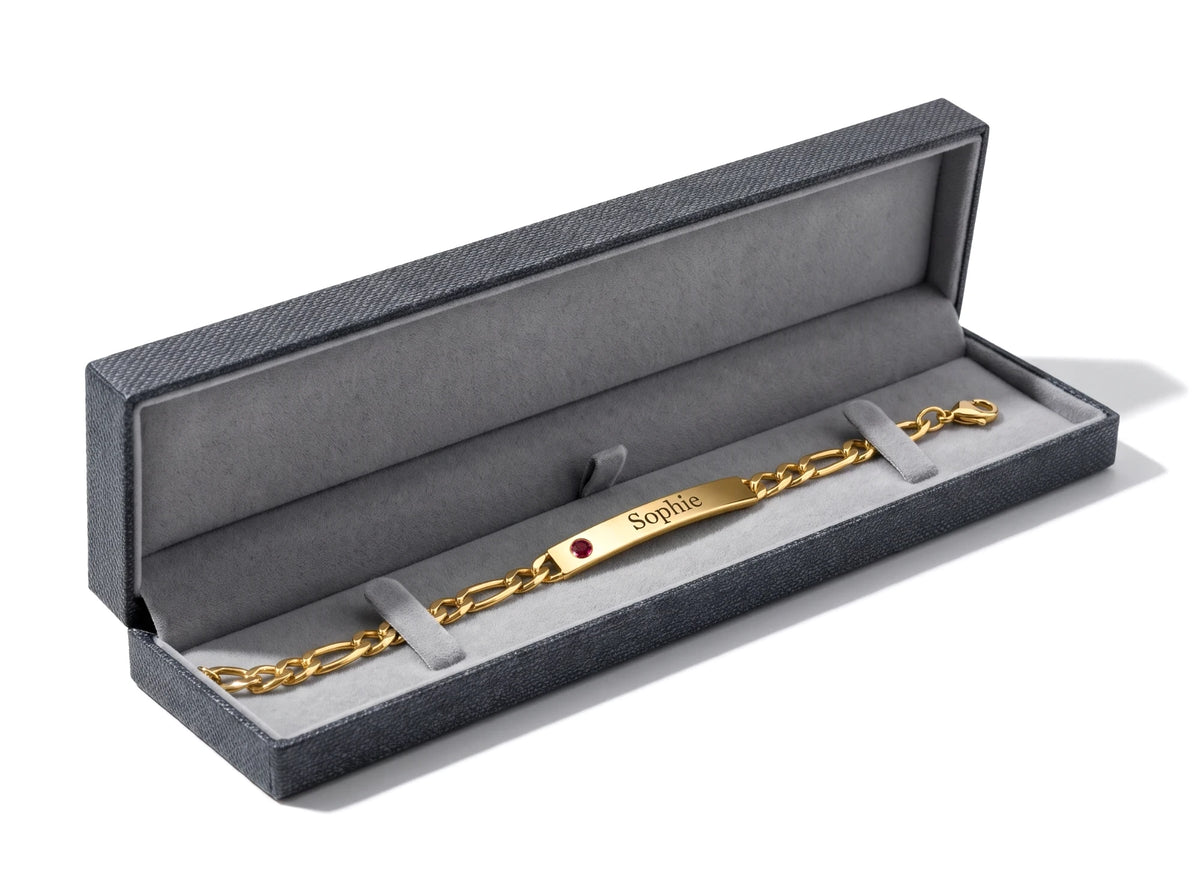 Long luxury bracelet box with a soft grey lining, shown with a name bracelet inside