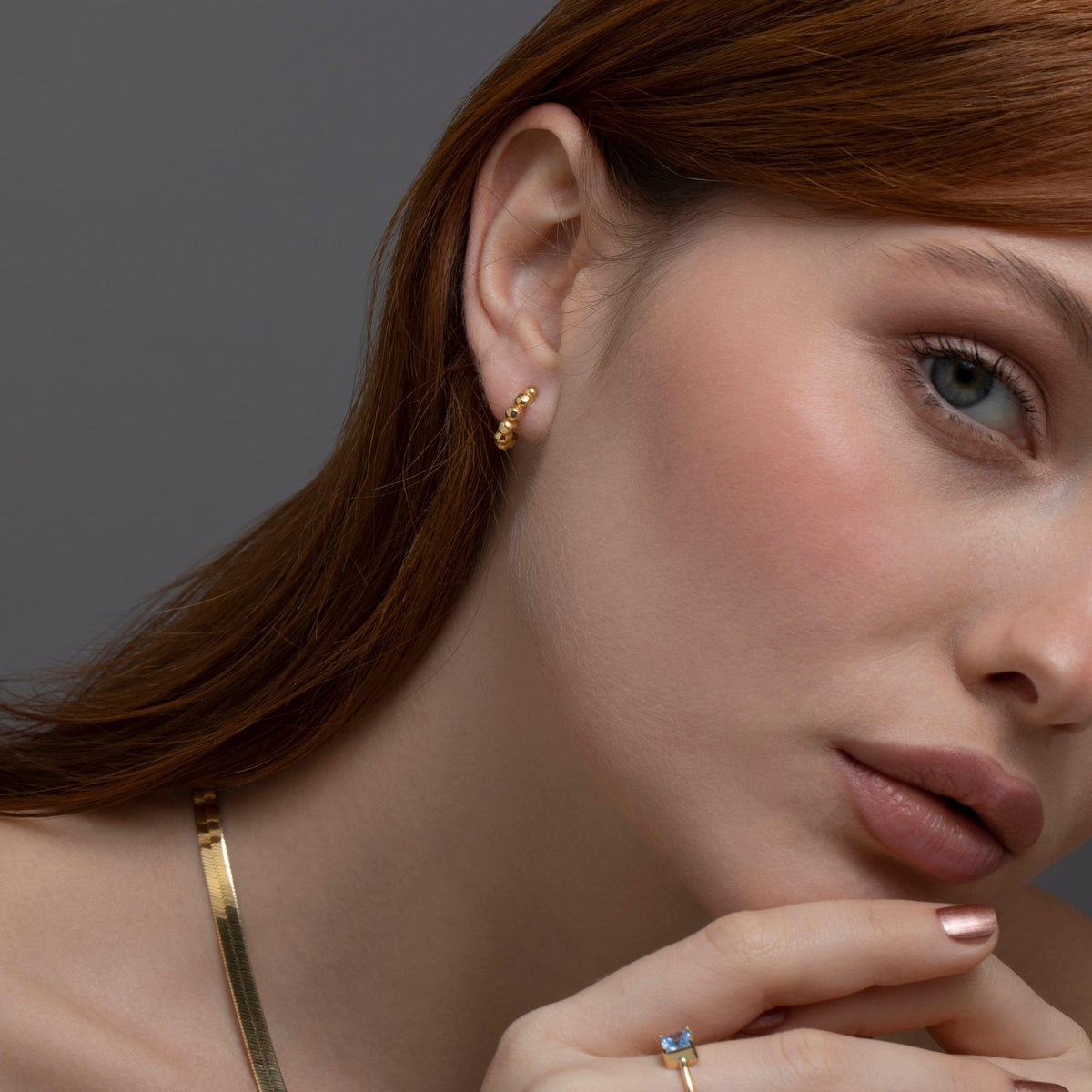 The Bubble Ball Huggie Hoop Earring styled in 18K Gold Vermeil — elegant everyday jewelry. Hypoallergenic for sensitive ears.