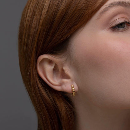 The Bubble Ball Huggie Hoop Earring as a graduation gift in 18K Gold Vermeil. Tarnish-resistant, made for keeping.