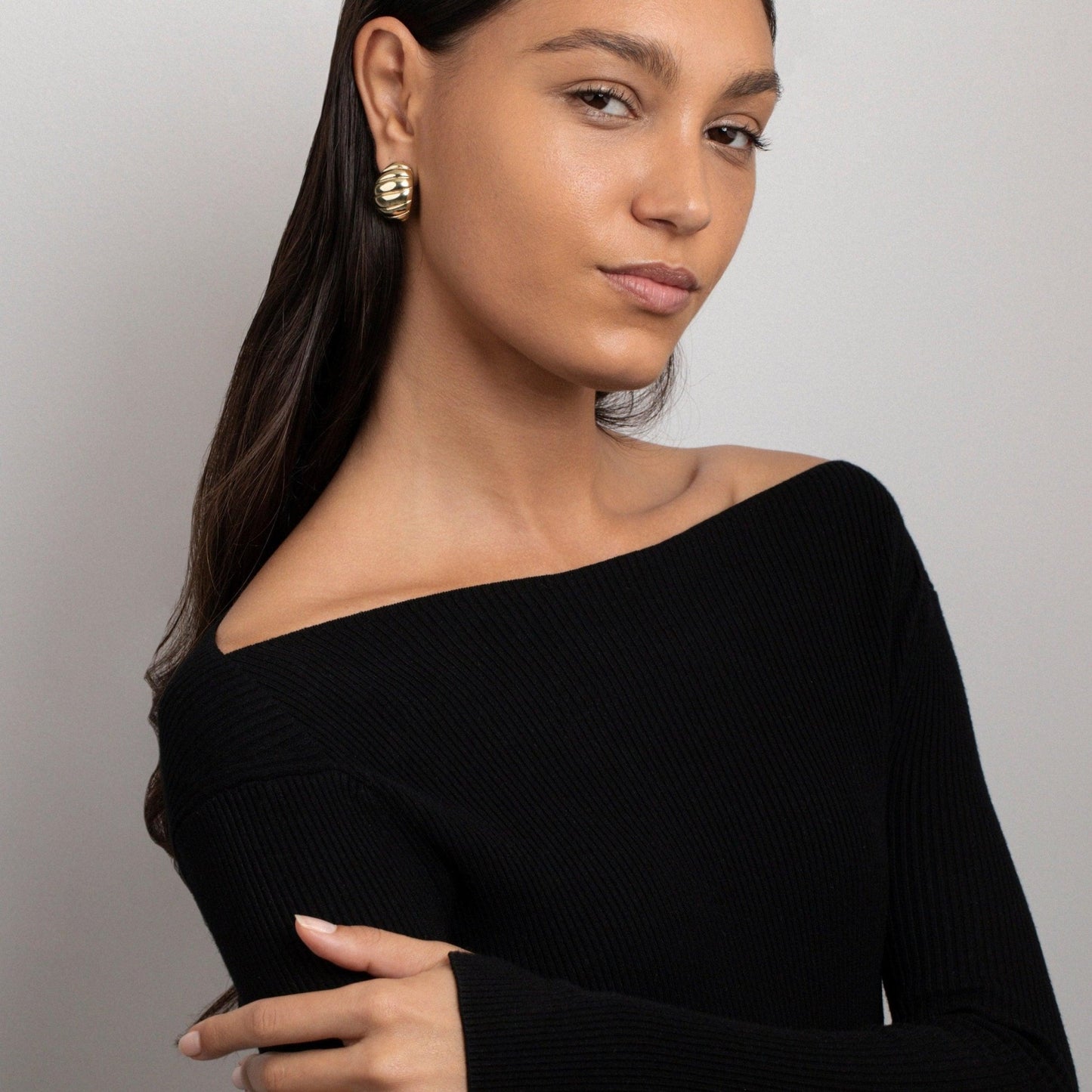 Close detail of the Chunky Croissant Dome Earrings in Gold-Plated Steel. Tarnish-resistant, premium handmade jewelry.
