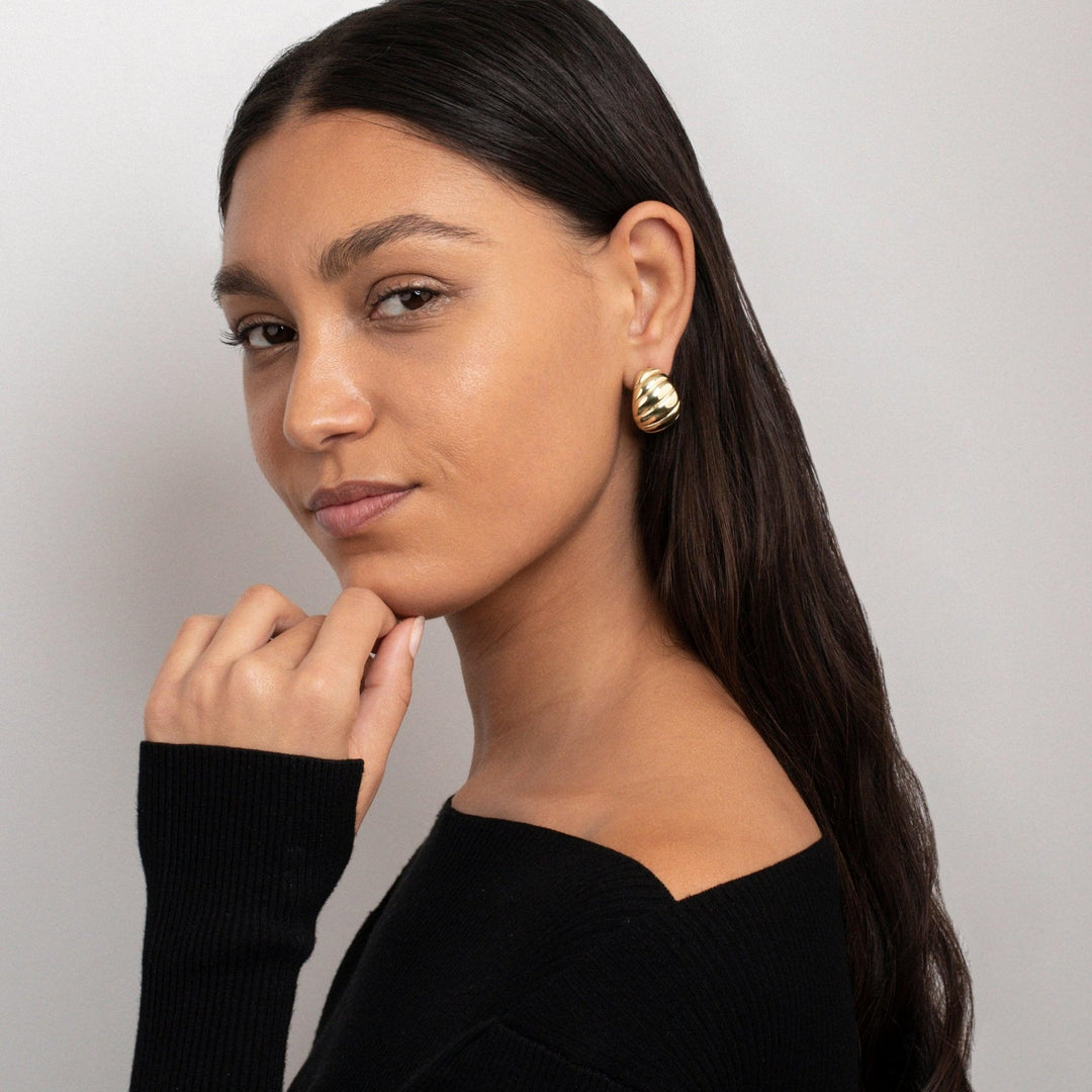The Chunky Croissant Dome Earrings as an anniversary gift in Gold-Plated Steel. Tarnish-resistant, made for keeping.