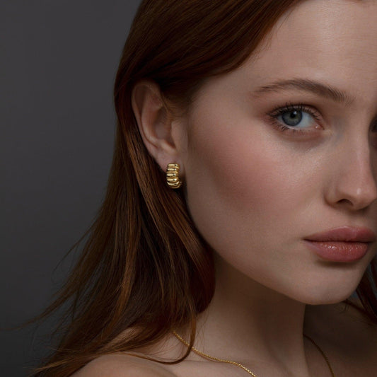 Close detail of the Chunky Croissant Hinged Hoop Earrings in 18K Gold Vermeil. Tarnish-resistant, premium handmade jewelry.