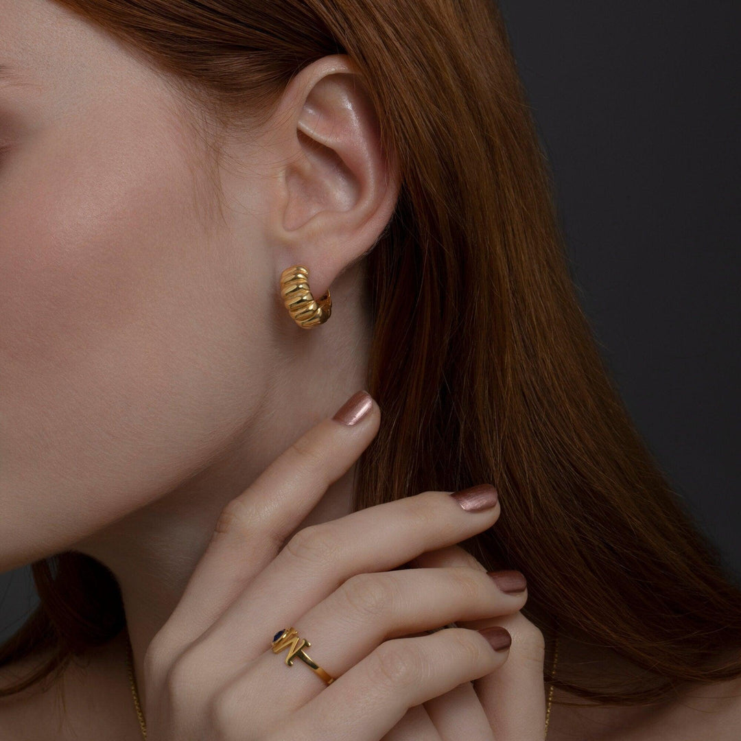 The Chunky Croissant Hinged Hoop Earrings styled in 18K Gold Vermeil — elegant everyday jewelry. Hypoallergenic.