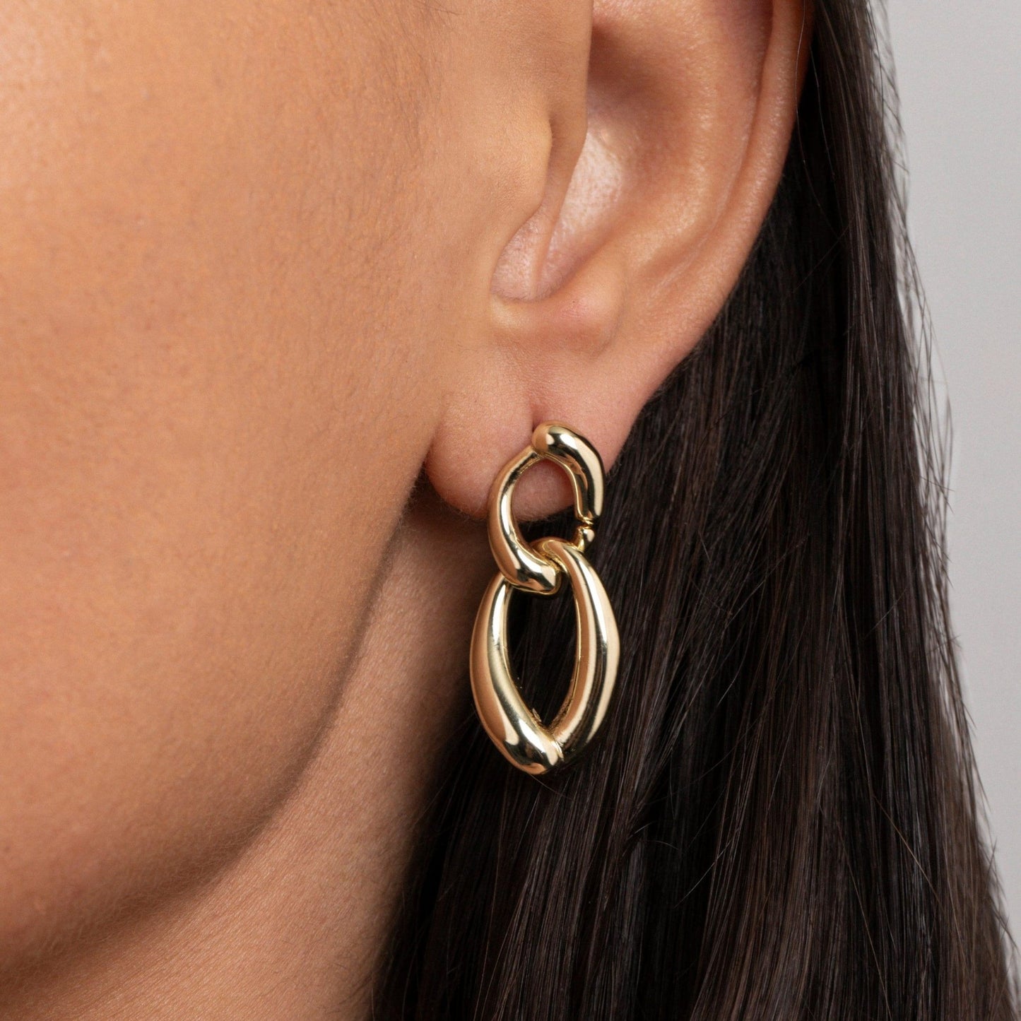 Close detail of the Chunky Link Drop Earrings in Gold-Plated Steel. Tarnish-resistant, premium handmade jewelry.