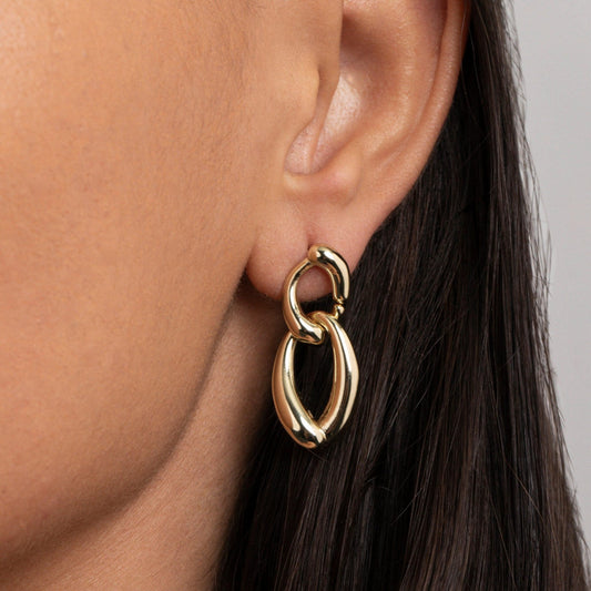 Close detail of the Chunky Link Drop Earrings in Gold-Plated Steel. Tarnish-resistant, premium handmade jewelry.
