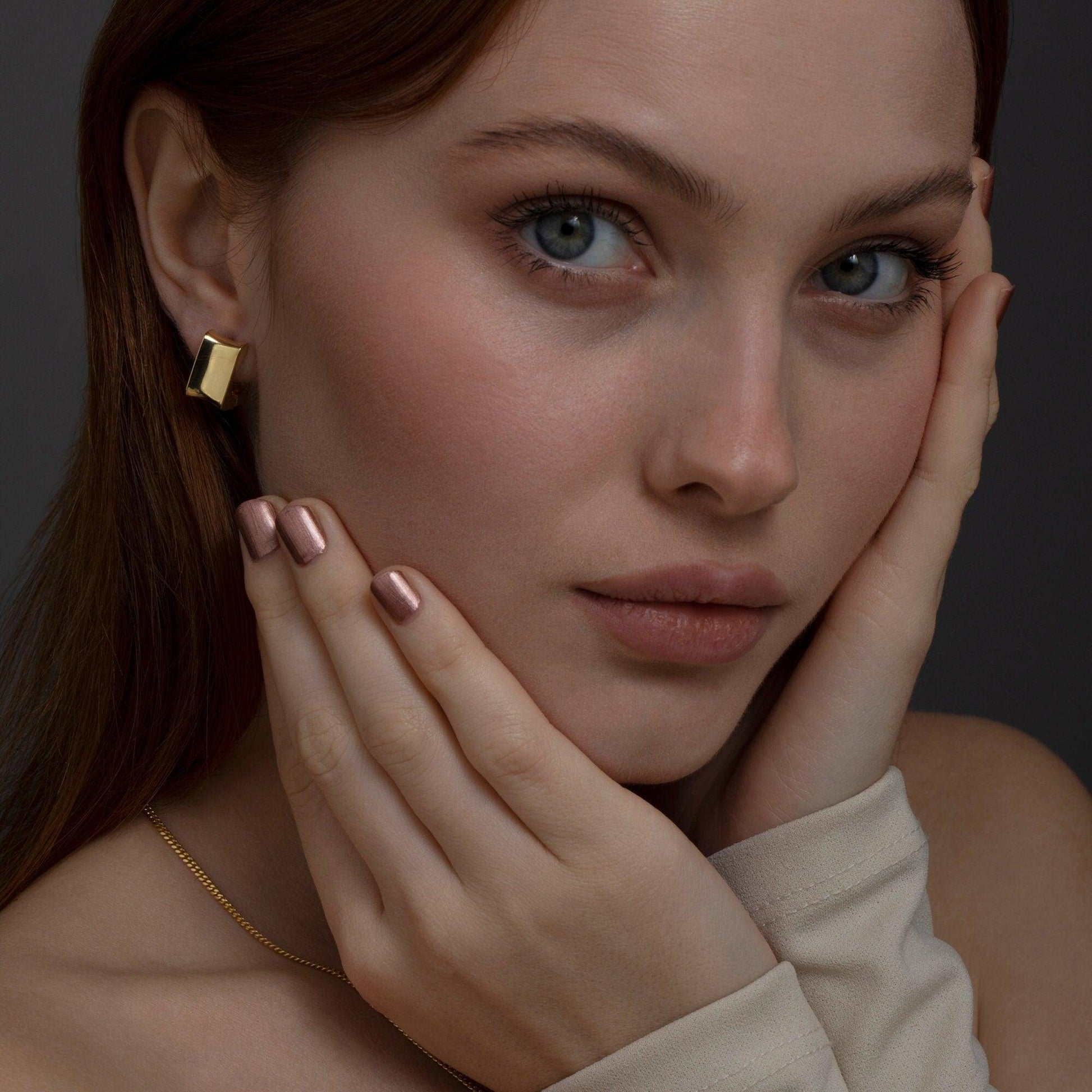 Close detail of the Chunky Square Huggie Hoop Earrings in 18K Gold Vermeil. Tarnish-resistant, premium handmade jewelry.