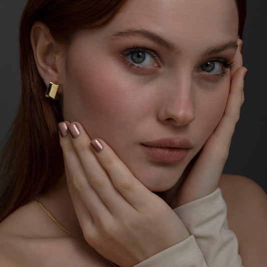 Close detail of the Chunky Square Huggie Hoop Earrings in 18K Gold Vermeil. Tarnish-resistant, premium handmade jewelry.
