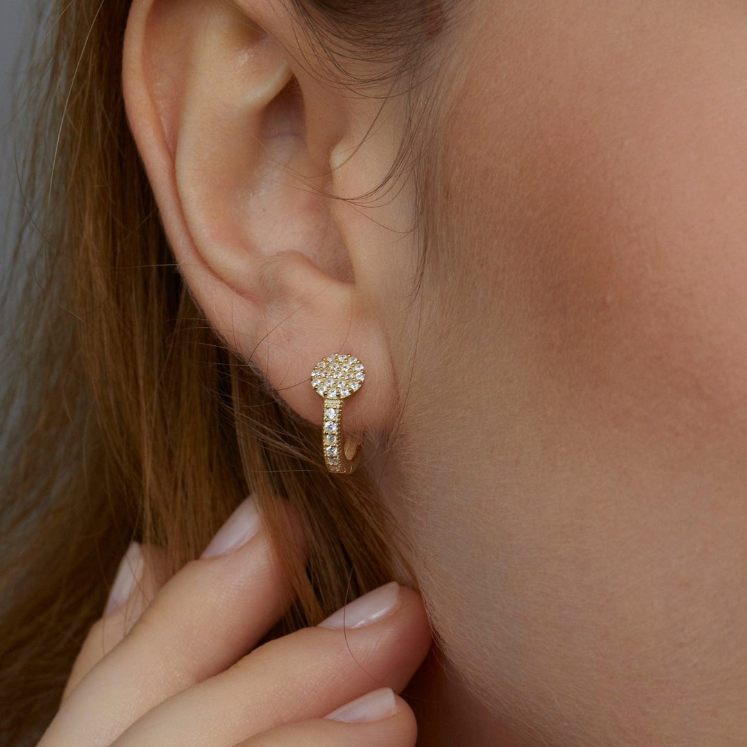 Macro detail of the Circle Pavé Hoop Earrings: CZ Diamond set in 18K Gold Vermeil. No green marks, handmade jewelry.