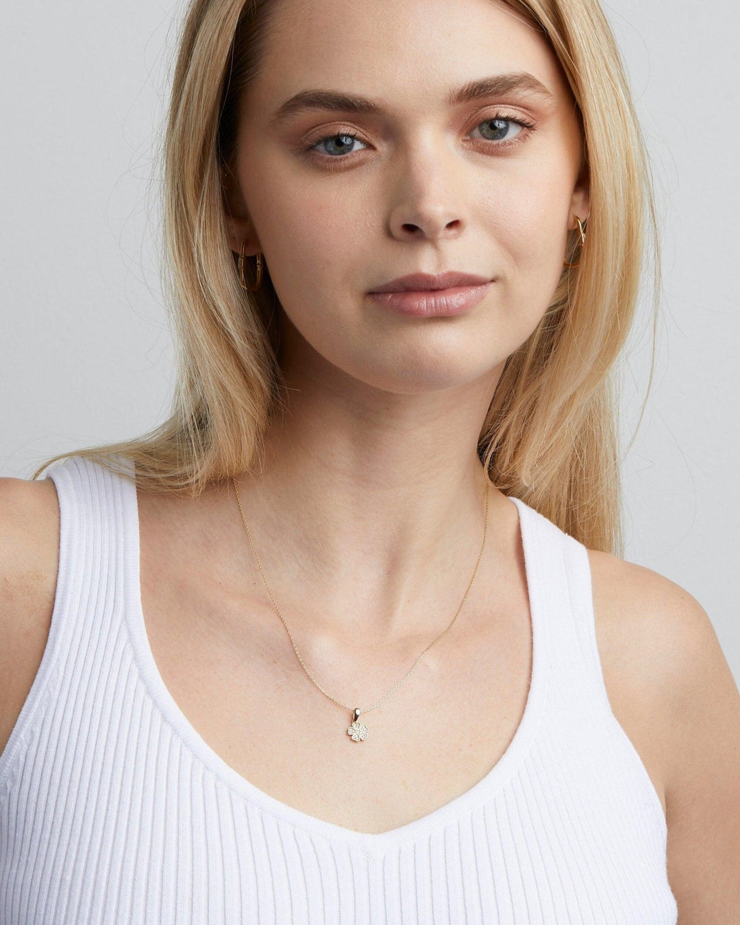 The Clover Necklace with CZ Diamonds styled in 18K Gold Vermeil — elegant everyday jewelry. Hypoallergenic, no green marks.