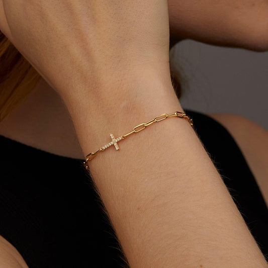 Close detail of the Cross Bracelet with Paperclip Chain in 18K Gold Vermeil. Safe for sensitive skin, premium handmade.