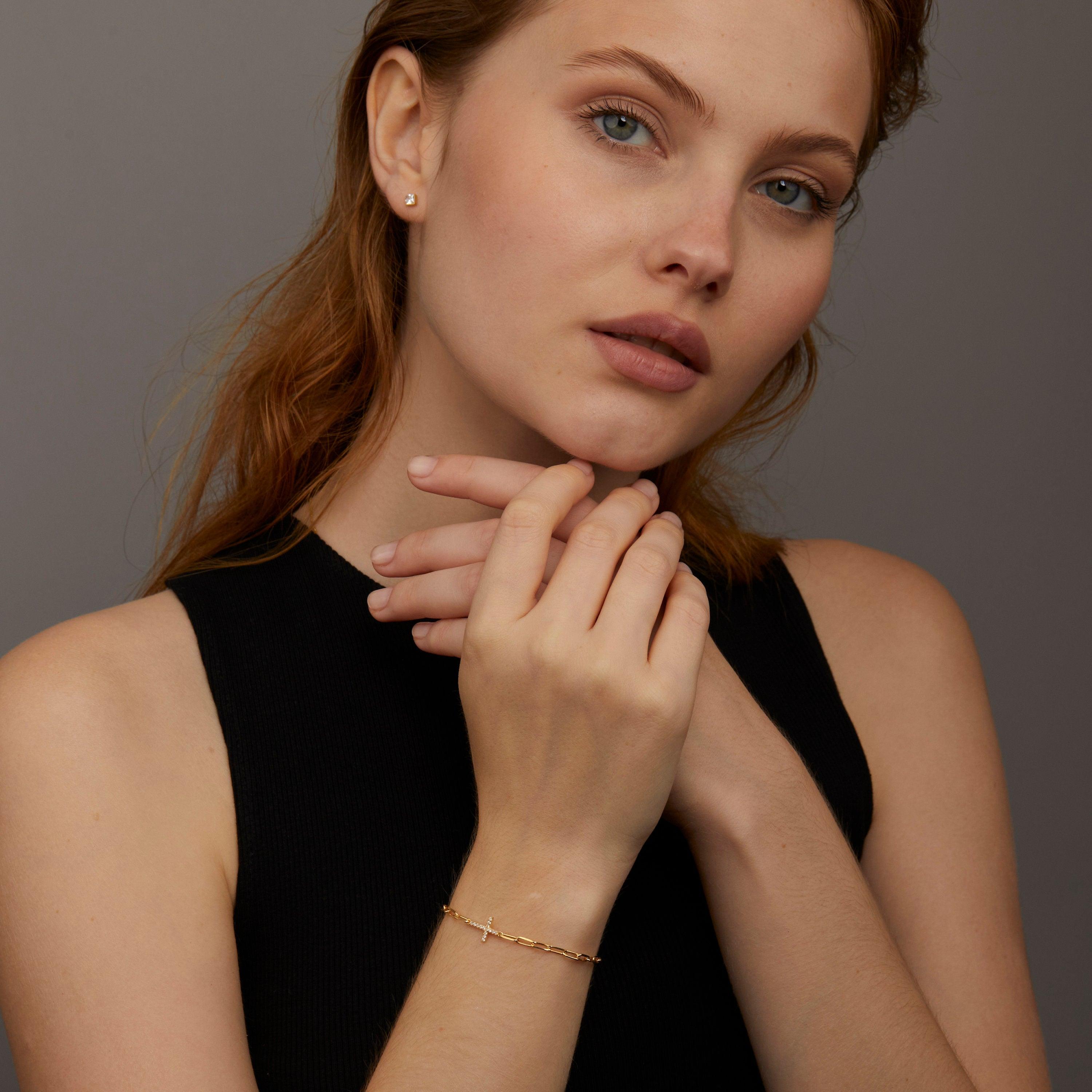 The Cross Bracelet with Paperclip Chain styled in 18K Gold Vermeil — elegant everyday jewelry. Hypoallergenic, no green.