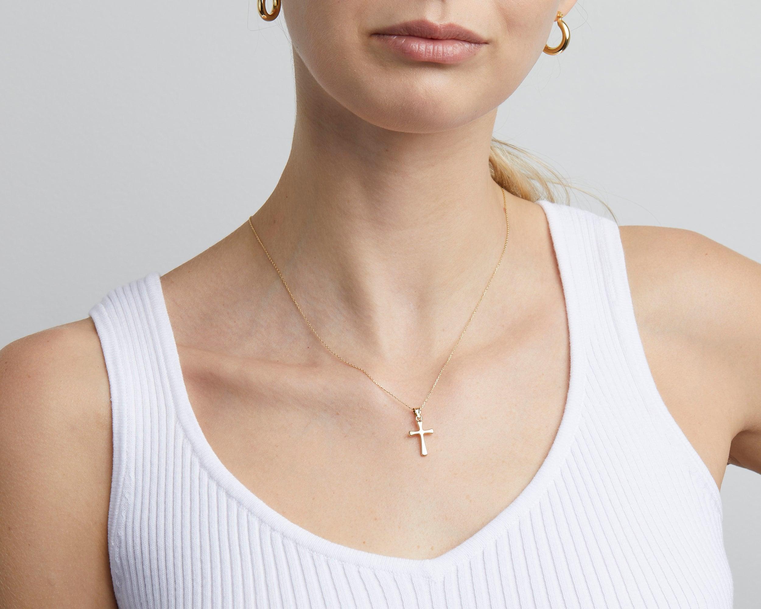 Close detail of the Small Cross Necklace for Women in 18K Gold Vermeil. Safe for sensitive skin, premium handmade jewelry.