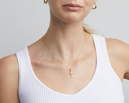 Close detail of the Small Cross Necklace for Women in 18K Gold Vermeil. Safe for sensitive skin, premium handmade jewelry.