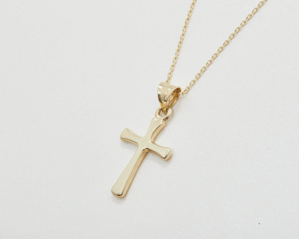 The Small Cross Necklace for Women as a confirmation gift in 18K Gold Vermeil. Safe for sensitive skin, made for keeping.