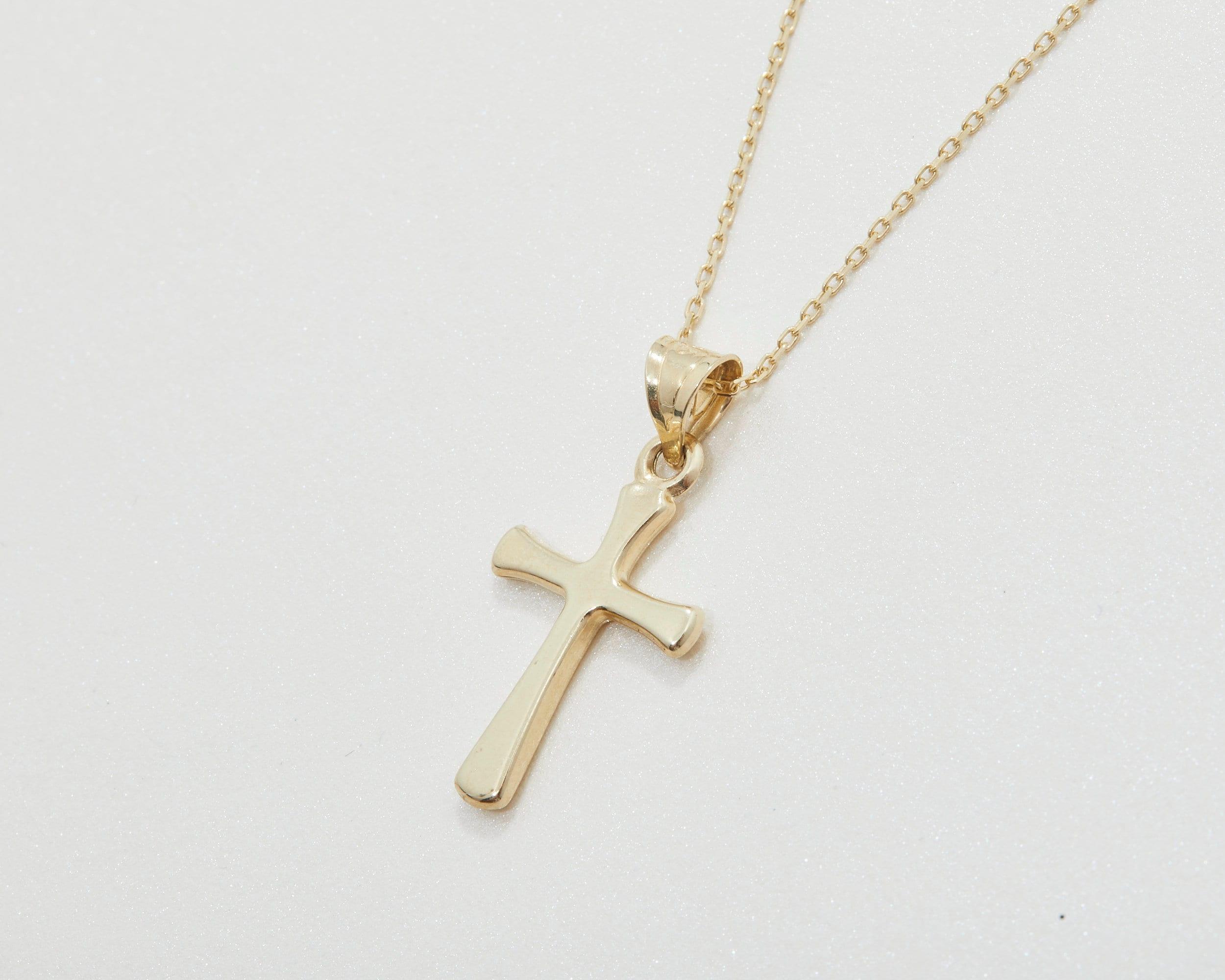 The Small Cross Necklace for Women as a confirmation gift in 18K Gold Vermeil. Safe for sensitive skin, made for keeping.